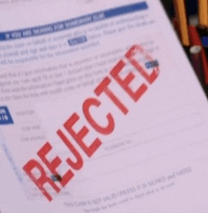 Paper with rejection stamp.